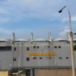 Back exterior view of Onikan Arena (Mobolaji Johnson Arena) in Lagos showing the stadium facade and surroundings