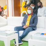 Obafemi Hamzat speaking on stage at the Lagos Hackathon 2020, wearing a suit and tie