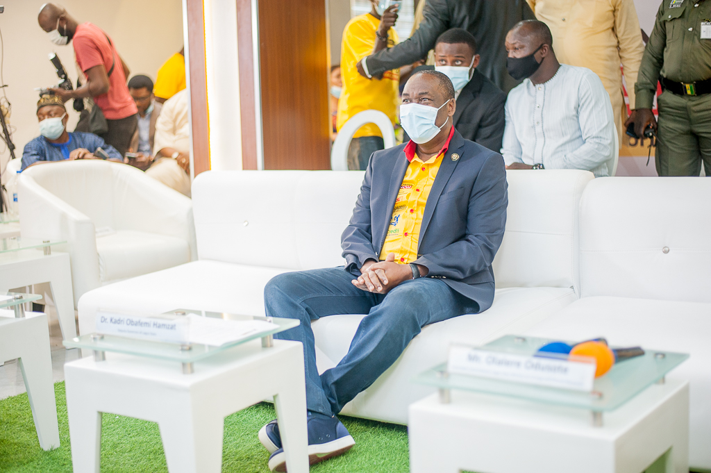 Obafemi Hamzat speaking on stage at the Lagos Hackathon 2020, wearing a suit and tie