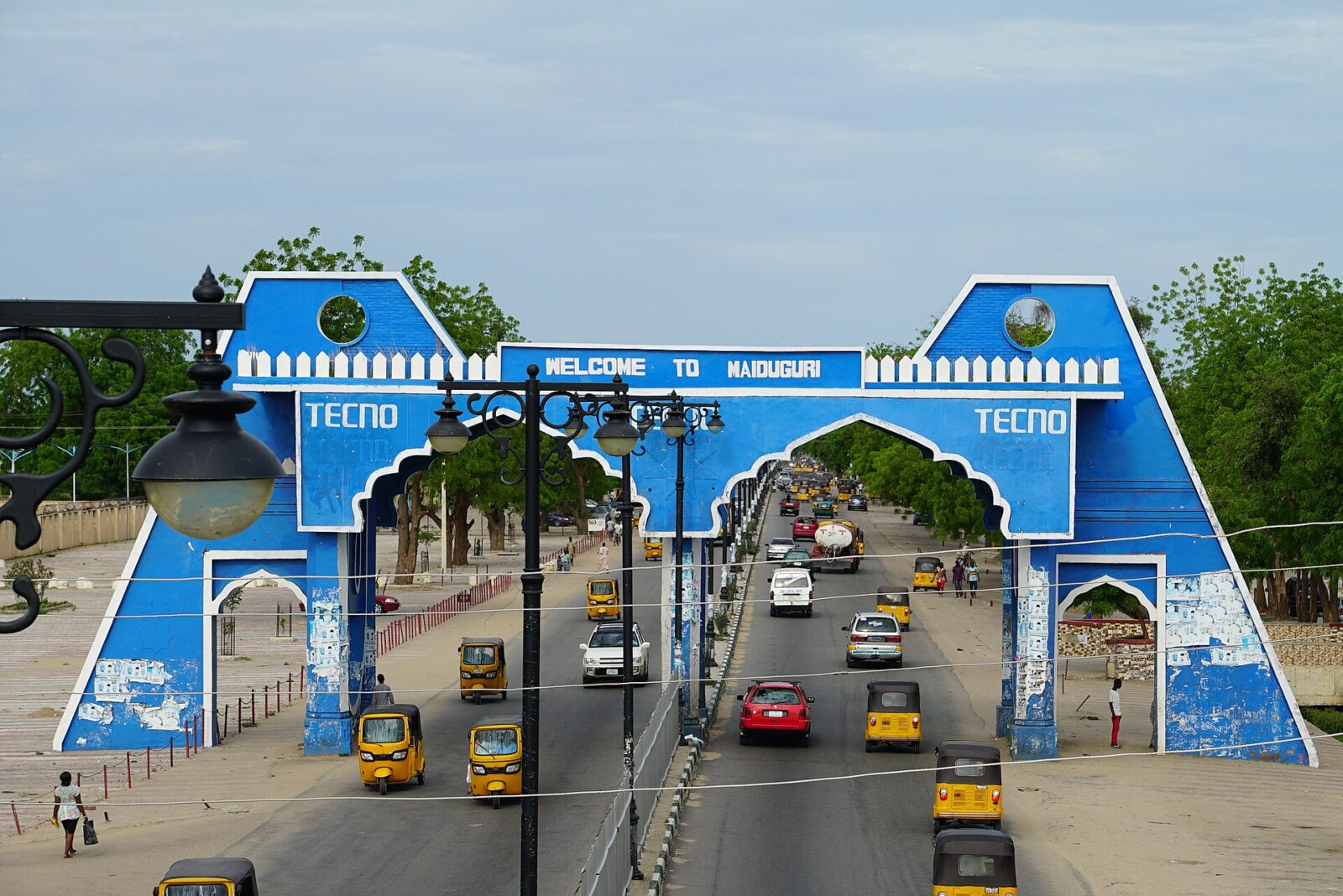 Maiduguri city gate with palm trees and road in Borno State, Nigeria