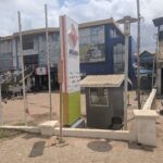Front signboard and entrance of an Access Bank branch in Madina, Ghana