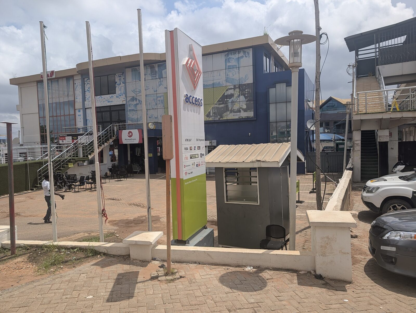 Front signboard and entrance of an Access Bank branch in Madina, Ghana