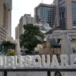 Tinubu Square in Lagos with traffic, buses and surrounding buildings