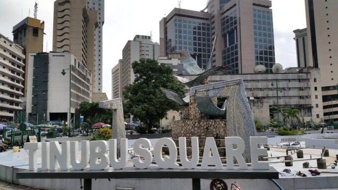 Tinubu Square in Lagos with traffic, buses and surrounding buildings