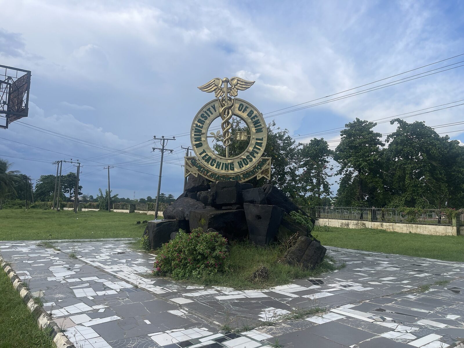 Entrance view of the University of Benin Teaching Hospital building with driveway and signage