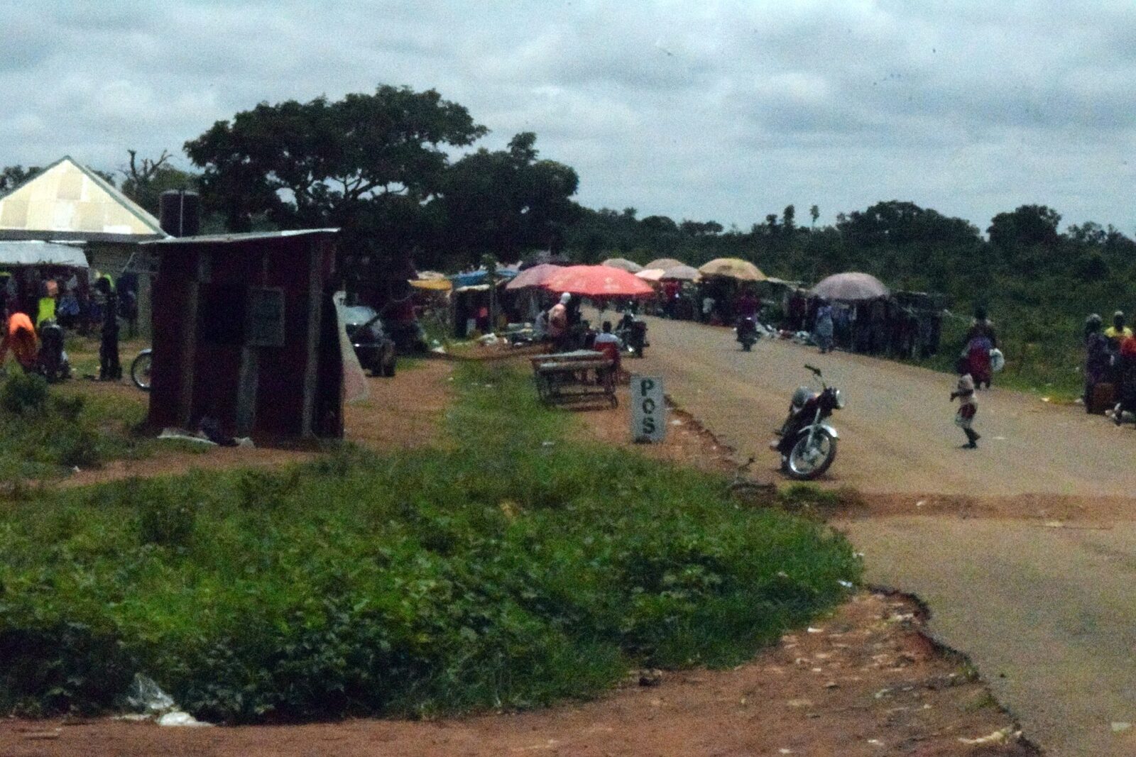 Sabon Gari Chori market junction in Kaduna State with street stalls and buildings