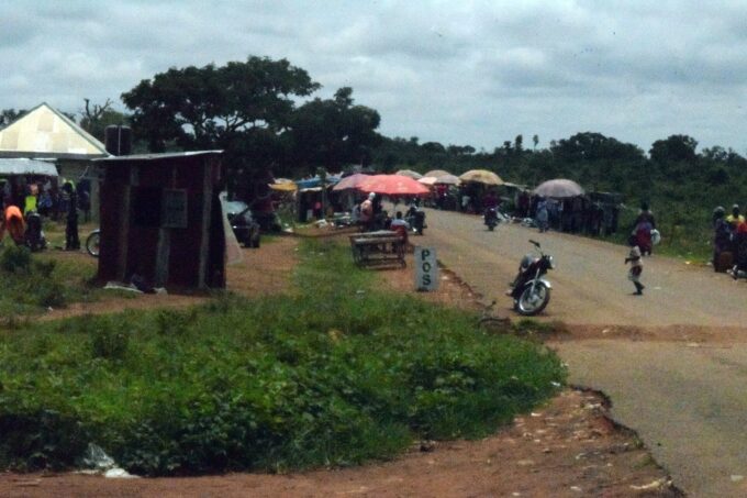 Sabon Gari Chori market junction in Kaduna State with street stalls and buildings
