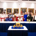 Ogiame Atuwatse III and Olori Atuwatse III with members of a royal mission in a group photograph