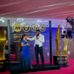 Ebuka Obi-Uchendu and Toke Makinwa onstage presenting at the 2020 AMVCA
