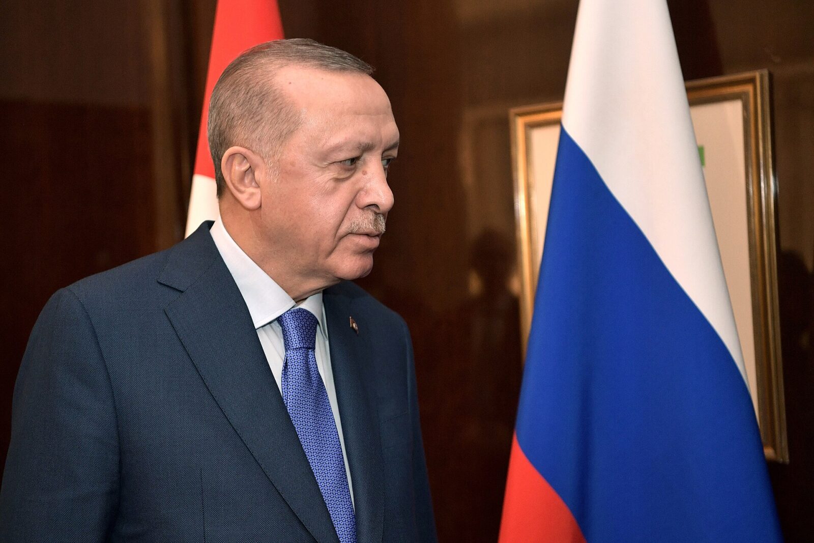 Turkish President Recep Tayyip Erdogan speaking at a podium during a 2020 visit to Germany